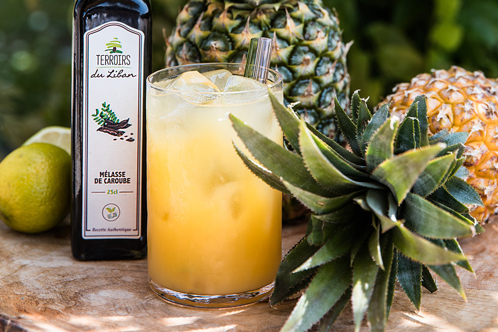 Summer Cocktail with Pineapple and Carob Molasses